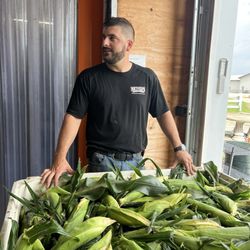 Rietveld Farm Stand - Owner after picking corn in the morning