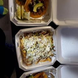 The Beef and Reef Mexican Tacos - Pastor and barbacoa tacos, Asada fries, and two pastor tacos.