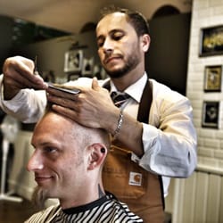 Hagi's Barber Shop • Stadtmitte - Barbering a la 1950. These guys know how to swing the scissor.