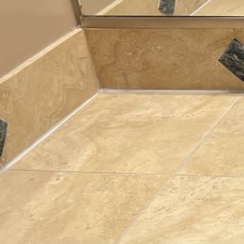 ANF Handyman Services - Placed a new layer of fresh grout in the seams of all our cracked bathroom vanity tile angles - Handyman Near Me