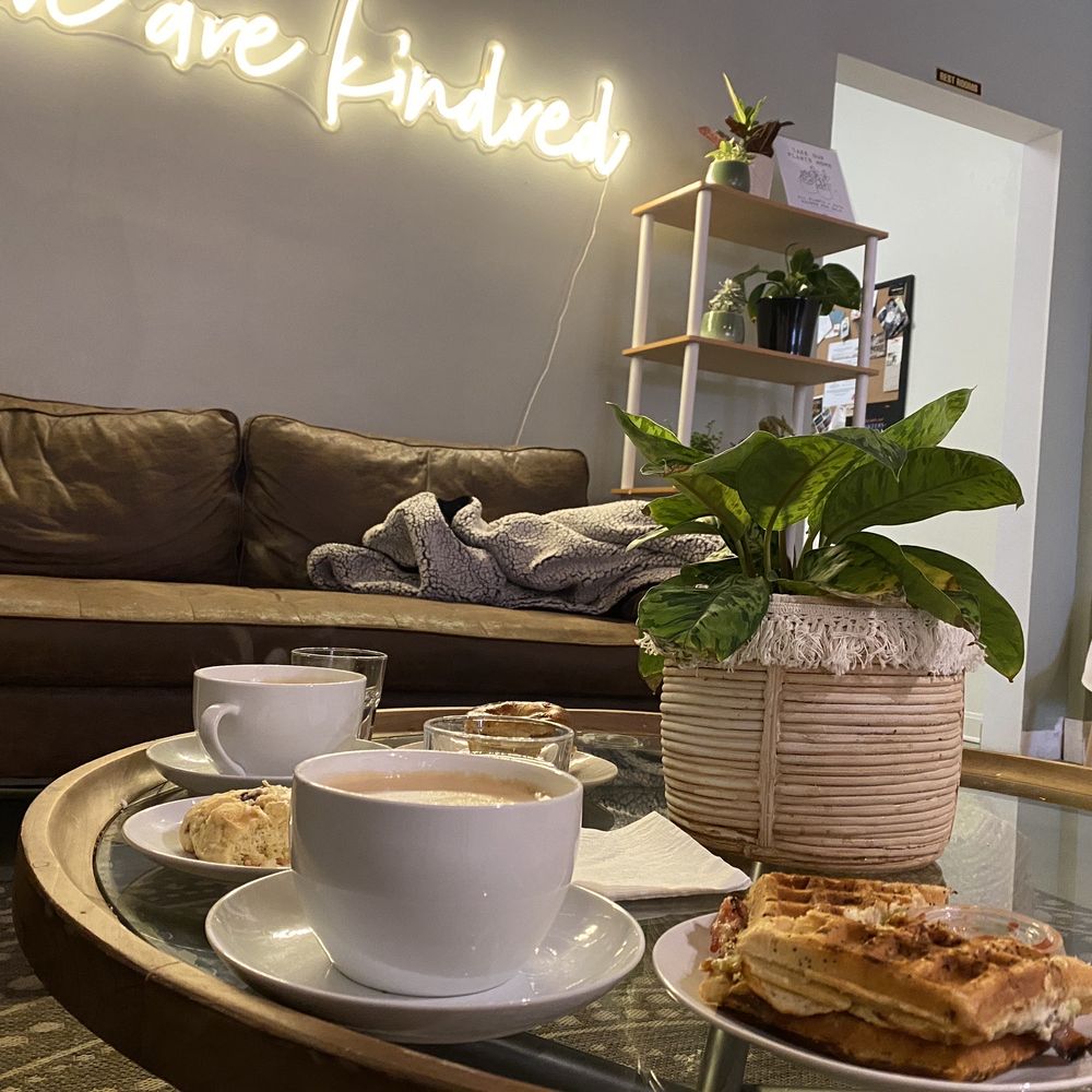 a coffee and pastries on a glass table