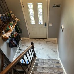 Removed and replaced the foyer flooring Removed and replaced the foyer flooring