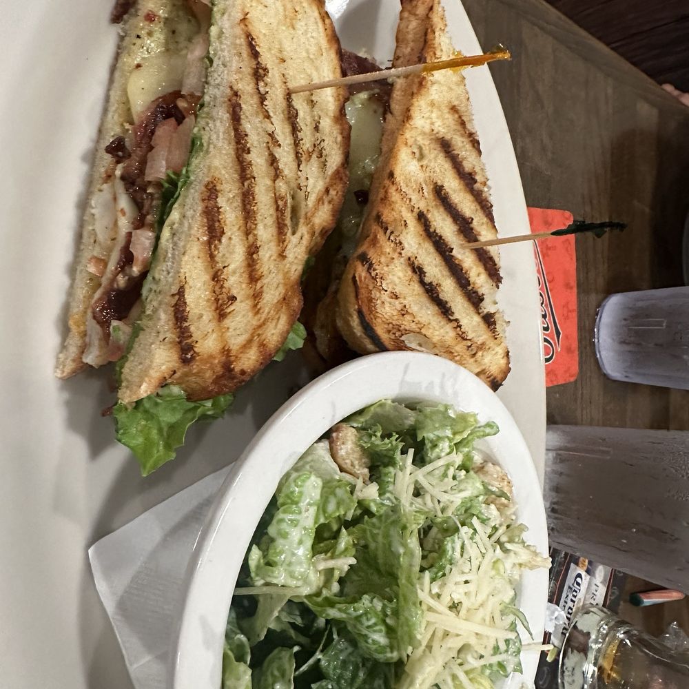 Shrimp and bacon sandwich with Caesar salad Shrimp and bacon sandwich with Caesar salad