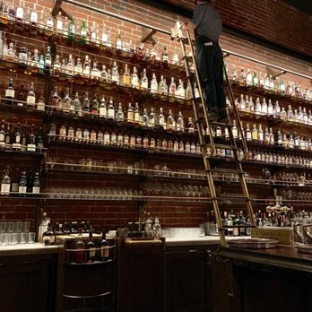 Multnomah Whiskey Library - Your server uses the ladder to climb up to retrieve your liquor - Lounges Near Me - Portland, Oregon