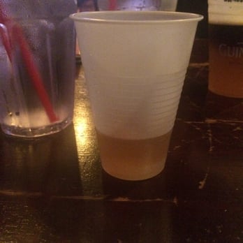 UNREAL! 15yr. Scotch whiskey served in a plastic cup.