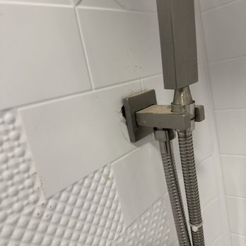 JDL General Contractor - Shower handle not fully attached to wall panel that we didn't ask for. Made decision to use this vs ceramic tile requested without consent. - General Contractors Near Me JDL General Contractor - Shower handle not fully attached to wall panel that we didn't ask for. Made decision to use this vs ceramic tile requested without consent. - General Contractors Near Me