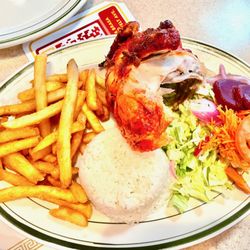 Pollos A La Brasa Mario - Half Chicken and rice.