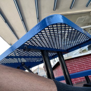 George's Drive-In - My leg chillin by the blue table waitin for my burrito. Hot sauce on my burrito babay - American Near Me - Riverside, California