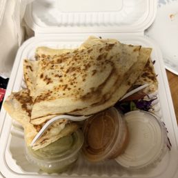 Birria quesadilla, cilantro, onions, with salsas fresca and sour cream, lettuce, tomato, cabbage. Birria quesadilla, cilantro, onions, with salsas fresca and sour cream, lettuce, tomato, cabbage.