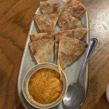Burma Superstar - Platha with coconut chicken curry dip - Burmese Near Me - Oakland, California Burma Superstar - Platha with coconut chicken curry dip - Burmese Near Me - Oakland, California