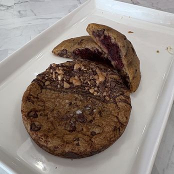 Synergy Sweets - Top- Red Velvet Stuffed Chocolate Chip Cookie Bottom - Toffee chocolate chip - Custom Cakes Near Me - Tampa, Florida Synergy Sweets - Top- Red Velvet Stuffed Chocolate Chip Cookie Bottom - Toffee chocolate chip - Custom Cakes Near Me - Tampa, Florida