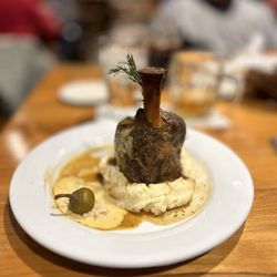 Pivovar - Braised pork shank with mashed potatoes, honey mustard, horseradish, pickled hot pepper, and rosemary.