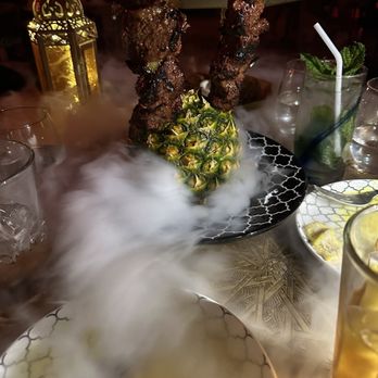 Marrakech - Famous skewered marinated beef served in a pineapple - Middle Eastern Near Me - Las Vegas, Nevada Marrakech - Famous skewered marinated beef served in a pineapple - Middle Eastern Near Me - Las Vegas, Nevada