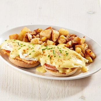 Sunset Grill - Three eggs over easy with peameal-style bacon on an English muffin, topped with Hollandaise sauce, paprika and fresh chives. - Diners Near Me - St. Catharines, Ontario Sunset Grill - Three eggs over easy with peameal-style bacon on an English muffin, topped with Hollandaise sauce, paprika and fresh chives. - Diners Near Me - St. Catharines, Ontario