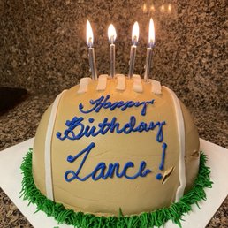 a birthday cake with lit candles