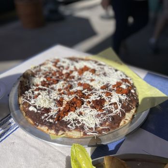 Flor De Oaxaca - Tlayuda de Choriqueso. One of the most delicious things I've tasted in a while! - Mexican Near Me - Santa Ana, California Flor De Oaxaca - Tlayuda de Choriqueso. One of the most delicious things I've tasted in a while! - Mexican Near Me - Santa Ana, California