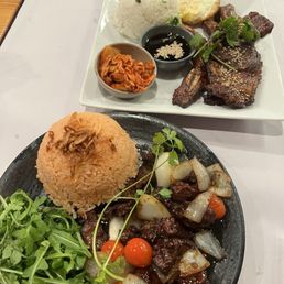 Shaking beef with tomato rice and Korean ribs dish