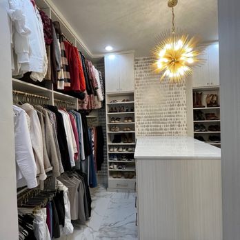 Custom Closets By Beverly - Light and bright but not white. We really took this gorgeous closet in Edmond up a notch by adding a beautiful light fixture and wallpaper. - Cabinetry Near Me - Edmond, Oklahoma Custom Closets By Beverly - Light and bright but not white. We really took this gorgeous closet in Edmond up a notch by adding a beautiful light fixture and wallpaper. - Cabinetry Near Me - Edmond, Oklahoma