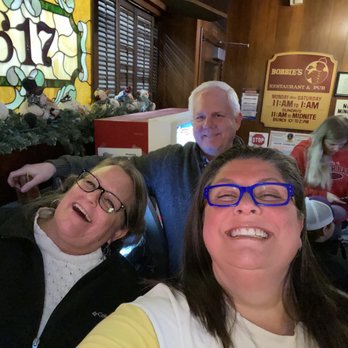 Six Seventeen - three people sitting at a table - Cocktail Bars Near Me - White Bear Lake, Minnesota