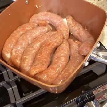Wiencek's Meats - a pan of sausages on a stove - Meat Shops Near Me - Cleveland, Ohio Wiencek's Meats - a pan of sausages on a stove - Meat Shops Near Me - Cleveland, Ohio