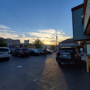 Rikas Peruvian Cuisine - a parking lot at sunset - Seafood Near Me - Los Angeles, California Rikas Peruvian Cuisine - a parking lot at sunset - Seafood Near Me - Los Angeles, California