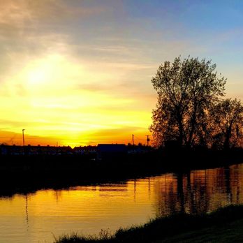 The Emigrant Bar - Sunset on the River Barrow in Athy by Robert Redmond - Pubs Near Me - Athy, KE