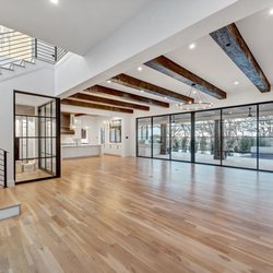 Luxury Home Realtors - Full wall of steel and glass opens to the outside pool oasis