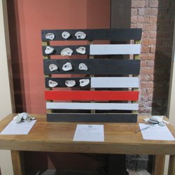 Apalachicola Oyster Cook-Off - Part of the silent auction. A painted pallet and oyster shells.