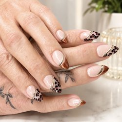 Romantic Nails - TAP hybrid gel almond nail set with copper tips and chrome accents.