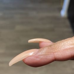 Acrylic not fully covering tip and uneven.