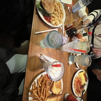 Denny's - (front left to right) Build Your Own Burger and The Big Dipper Melt (back left to right) Stack of Pancakes and Philly Cheesesteak Omelette - Diners Near Me - Artesia, California Denny's - (front left to right) Build Your Own Burger and The Big Dipper Melt (back left to right) Stack of Pancakes and Philly Cheesesteak Omelette - Diners Near Me - Artesia, California