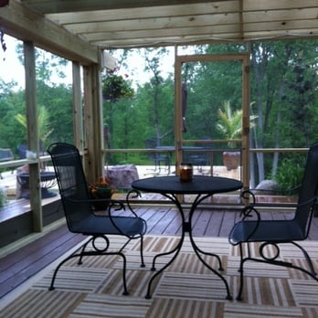 Vigh Landscape Management - a patio with a table and chairs - Snow Removal Near Me - Walker, Michigan Vigh Landscape Management - a patio with a table and chairs - Snow Removal Near Me - Walker, Michigan