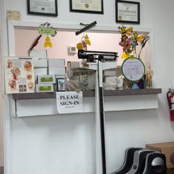 A Acupuncture Center - Check out the dead gnats all over the yellow ball above the I love my doctor sign.