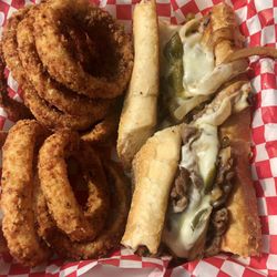 Pirates Galley - Philly cheesesteak & onion rings. Yummy!!