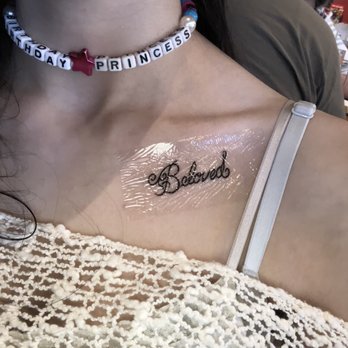 Atomic Tattoo - About 15 minutes later.  David put a protective cover over the tattoo so I didn't have to worry about my hair or bra strap irritating it - Piercing Near Me - Austin, Texas