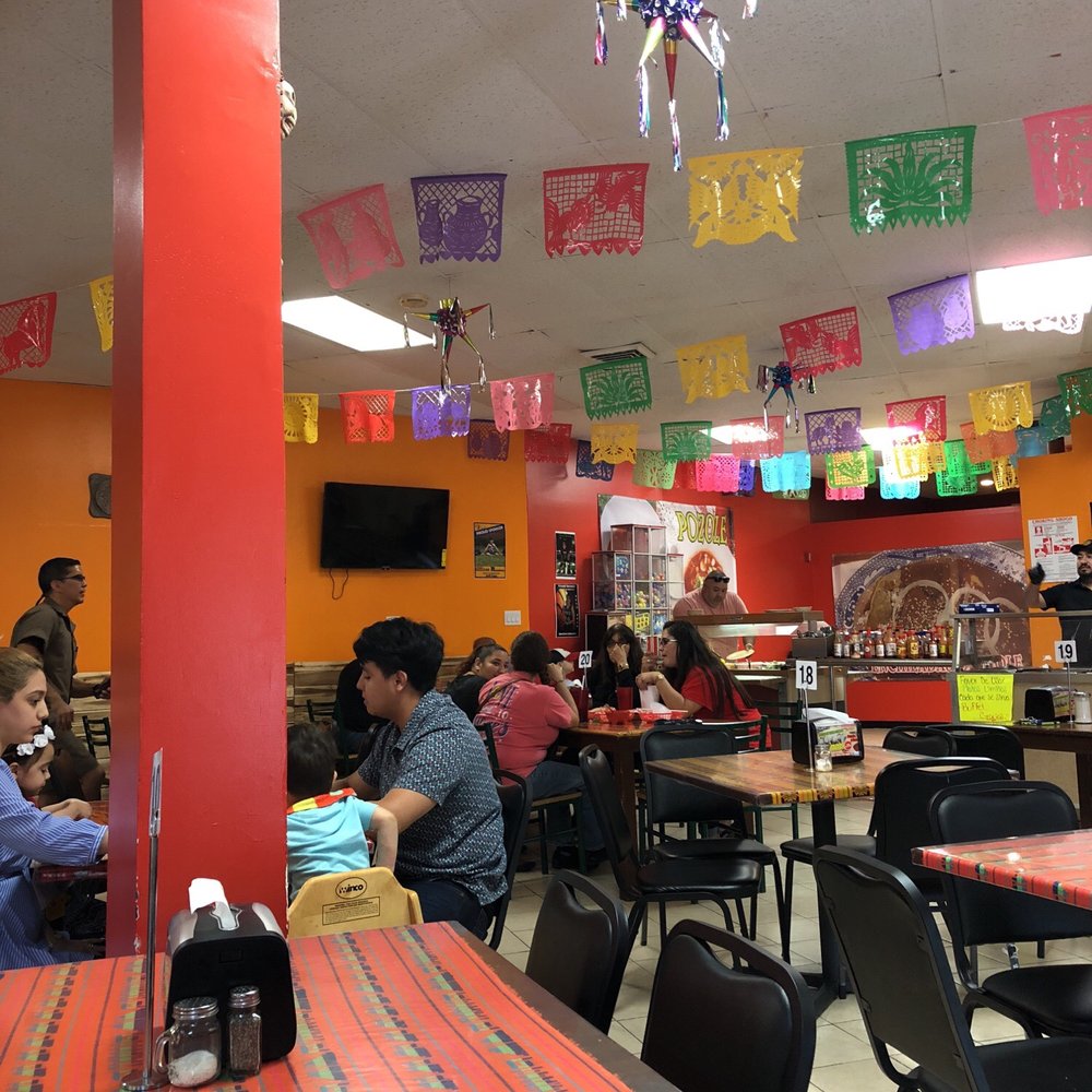 El Delirio - people eating at tables in a mexican restaurant - Mexican Near Me - Brownsville, Texas