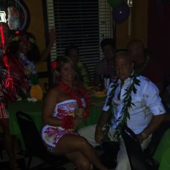 La Gitana - a man and a woman sitting at a table - Sports Bars Near Me - Coral Gables, Florida La Gitana - a man and a woman sitting at a table - Sports Bars Near Me - Coral Gables, Florida