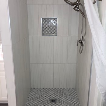 Redstar Construction - Replaced old shower with new tile & shower hardware. I love that I no longer have the ugly glass door to have to squeegee - General Contractors Near Me - Fontana, California Redstar Construction - Replaced old shower with new tile & shower hardware. I love that I no longer have the ugly glass door to have to squeegee - General Contractors Near Me - Fontana, California