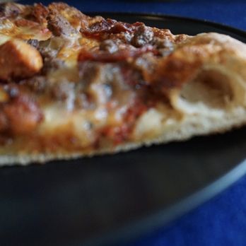 Maria’s Pizzeria  - Look at that crust. Not too thick or thin. I enjoyed it. Crust of the Mama Supreme # 3, All Meat Supreme. - Halal Near Me - Schaumburg, Illinois