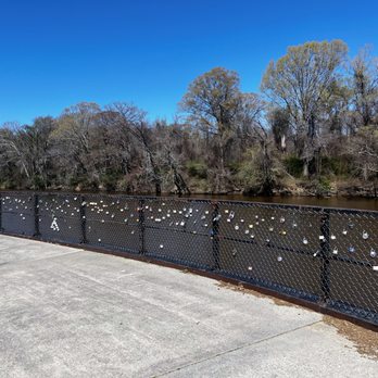 Town Common - Riverside walkway with colorful locks on the fence - Parks Near Me - Greenville, North Carolina