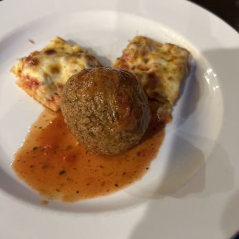 Barraco's - Meat ball showing size versus sliced pizza - Pizza Near Me - Orland Park, Illinois Barraco's - Meat ball showing size versus sliced pizza - Pizza Near Me - Orland Park, Illinois