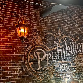 Prohibition ATX - a brick wall with a sign on it - Speakeasies Near Me - Austin, Texas Prohibition ATX - a brick wall with a sign on it - Speakeasies Near Me - Austin, Texas