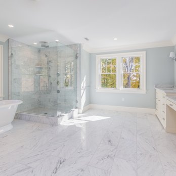 Absolute Granite & Design - a bathroom with a marble floor - General Contractors Near Me - Acton, Massachusetts