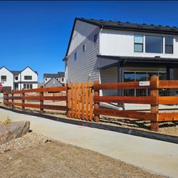 Integrity Fencing & Supply - 3 rail Modern Ranch Split Rail with spaced picket gate. We applied cedar tone stain by Wood Defender.