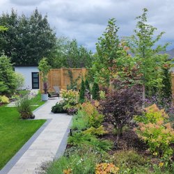 Coastal Islandscapes - Freshly mowed and edged front lawn, trimmed and pruned trees and bushes