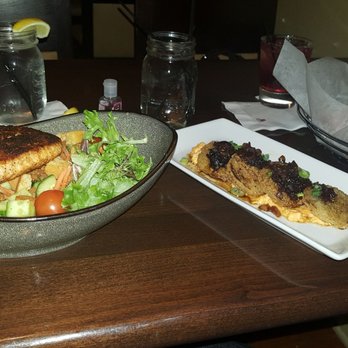Table South - Blackened salmon on a bed of local mixed greens, fried green tomatoes & buffalo wings. - New American Near Me - Chattanooga, Tennessee
