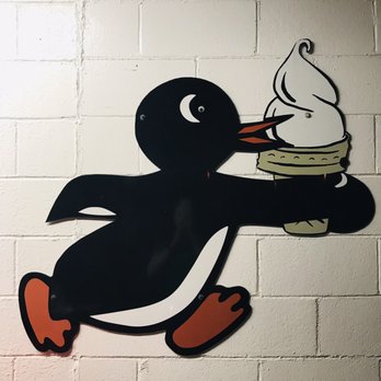 Earl's Dari Drive-In - a penguin holding an ice cream cone - Ice Cream & Frozen Yogurt Near Me - Coshocton, Ohio