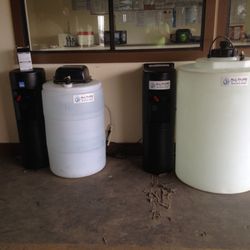 All Pure Water - 57 gallon on the left 115 on the right. Both are plumbed to our standard hot and cold dispensers.
