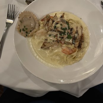 La Strada - Fettuccine Alfredo with chicken and jumbo shrimp. Excellent!  The round ravioli is La Strada's signature stuffed mushroom. - Italian Near Me - Reno, Nevada