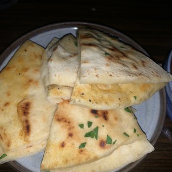 Sparrow + Wolf - Fresh naan bread from the wood fire oven. - New American Near Me - Las Vegas, Nevada Sparrow + Wolf - Fresh naan bread from the wood fire oven. - New American Near Me - Las Vegas, Nevada